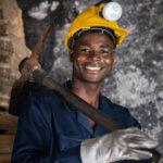 Miner looking happy working at the mine